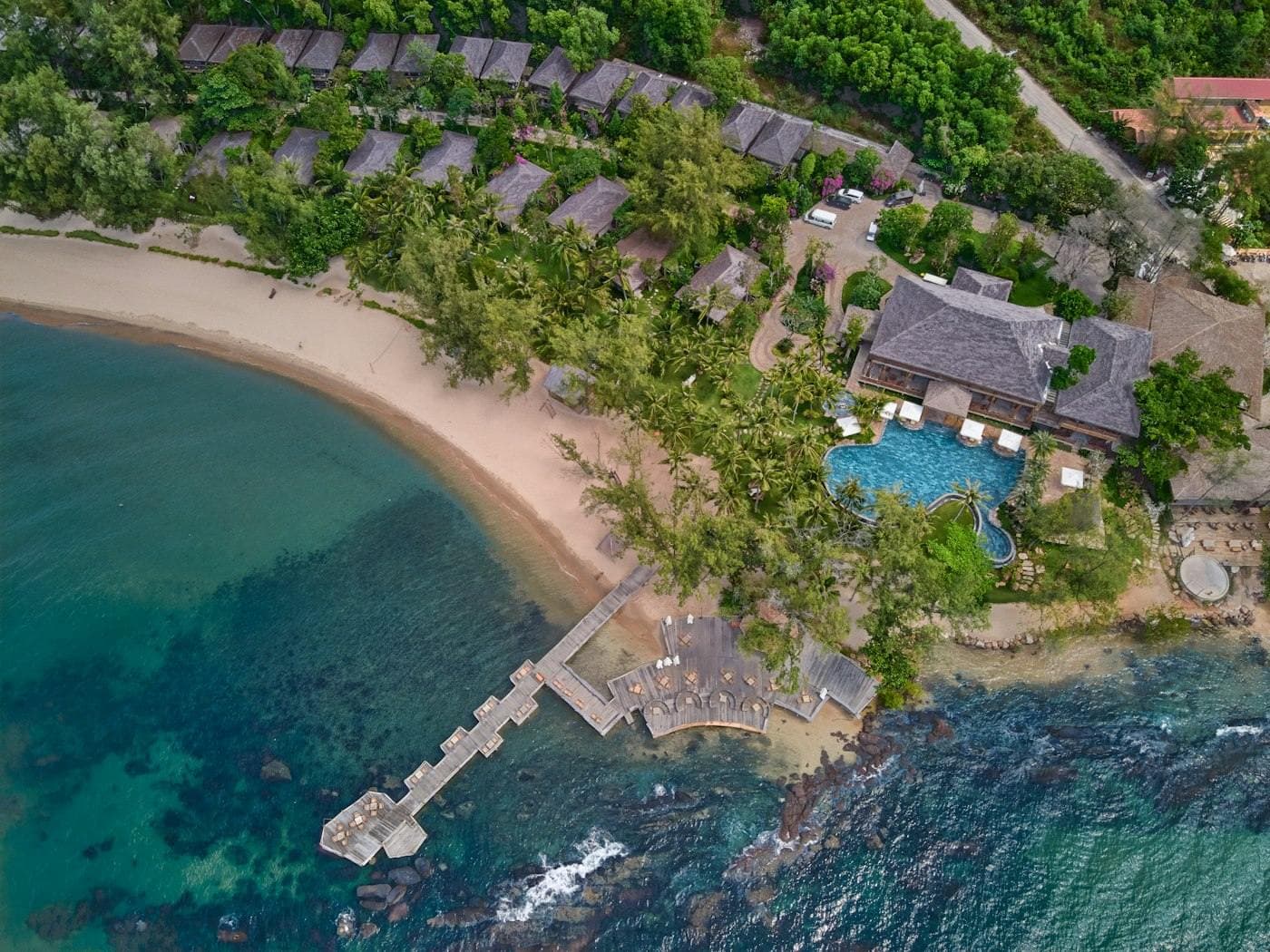 Beachfront resort on Phu Quoc from above: villas, pool and pier