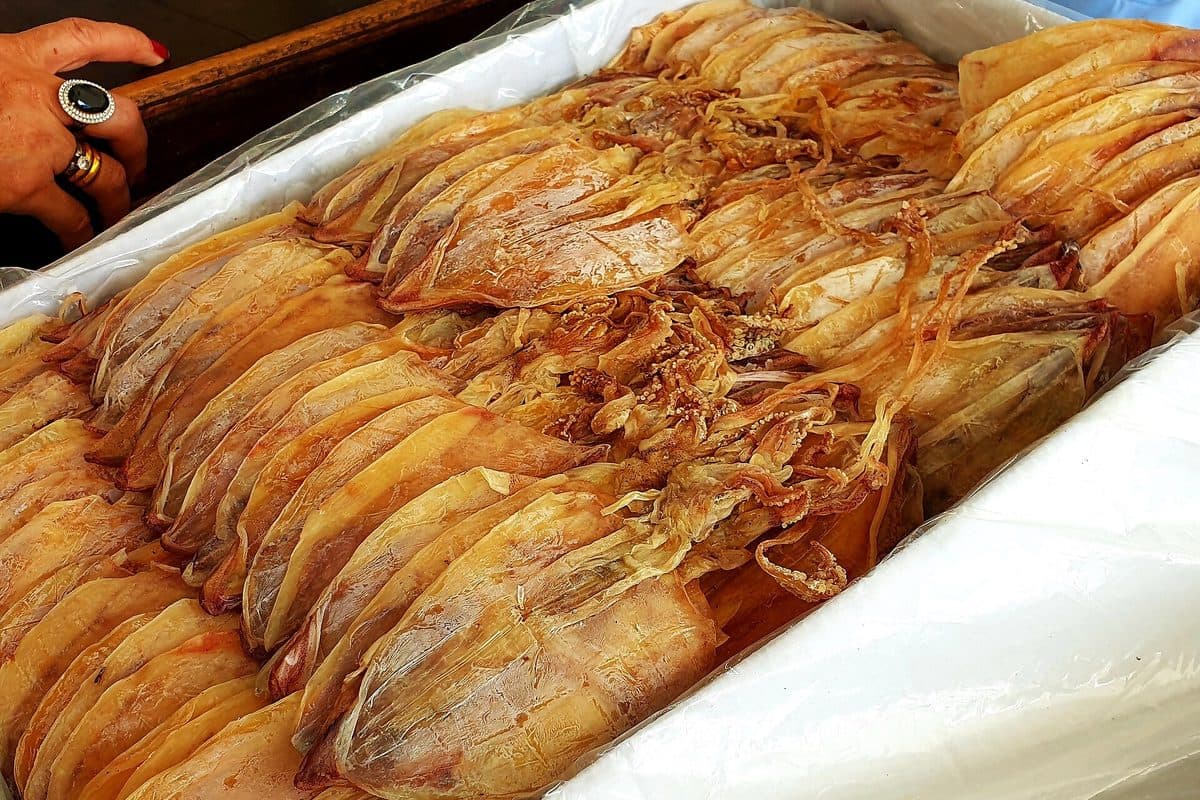 A box of dried squid, mực khô, on a counter in Phan Thiet