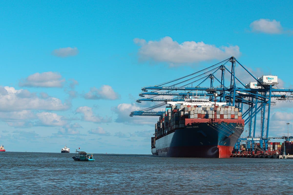 Container ship under the gantry cranes of the international container terminal in Hai Phong