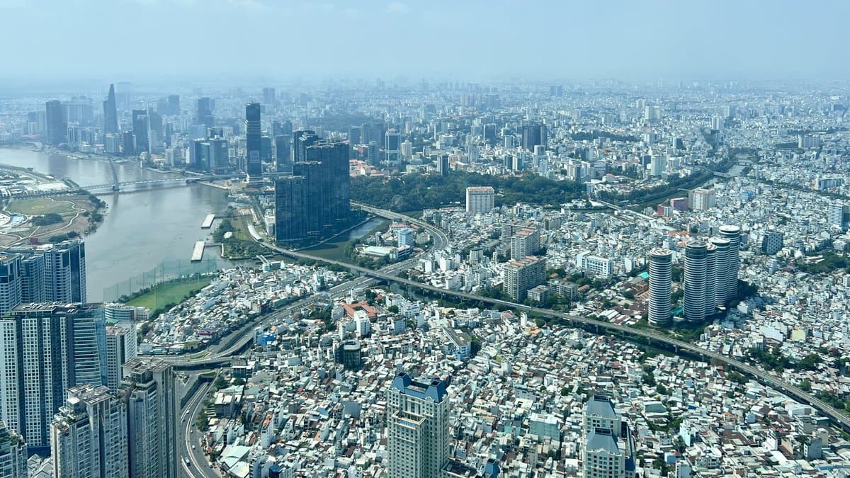 Ho Chi Minh City from above: apartment towers along the Saigon River and low-rise blocks to the horizon