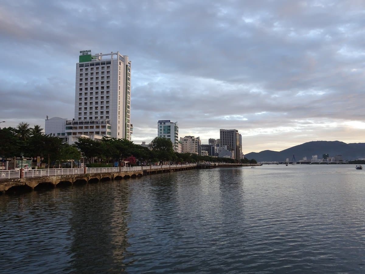 Han River waterfront in Da Nang with high-rises and the Han Bridge on the horizon