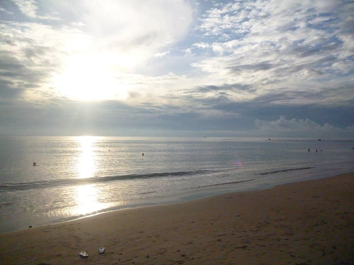 Ninh Chu beach near Phan Rang in the morning, sun over a calm sea