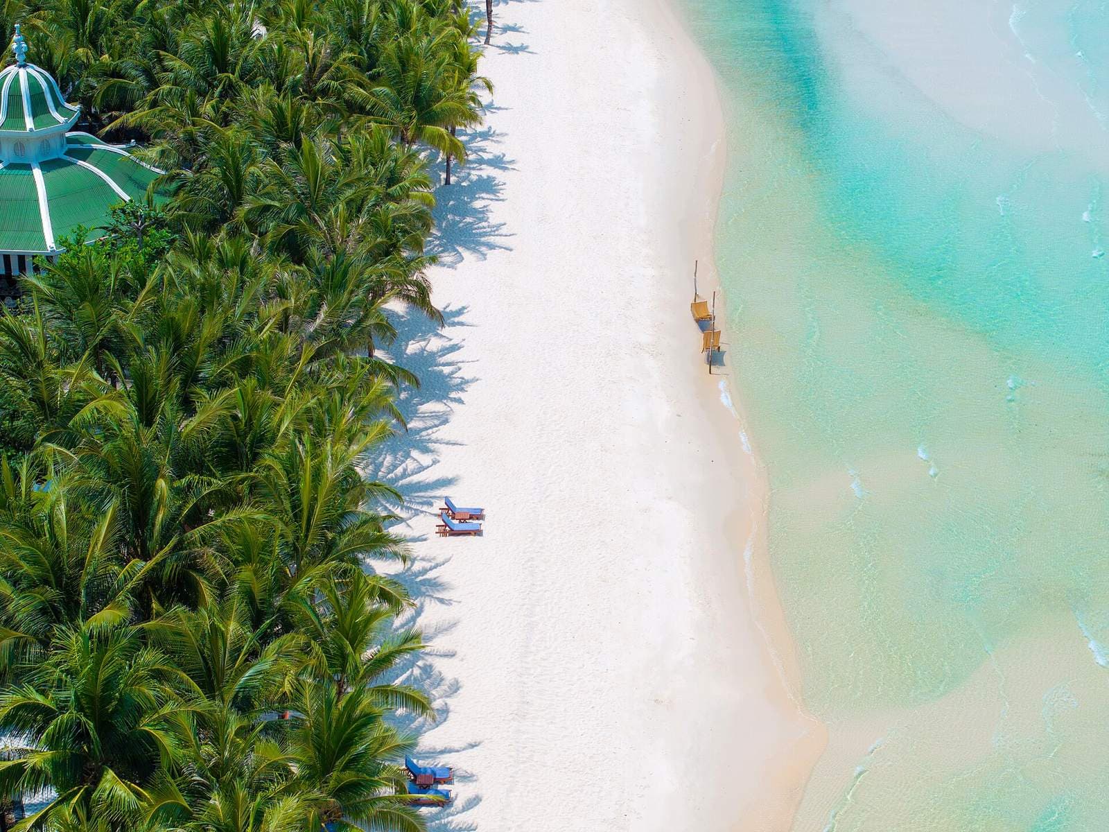 Aerial view of Kem Beach on Phu Quoc with white sand, turquoise water and palms