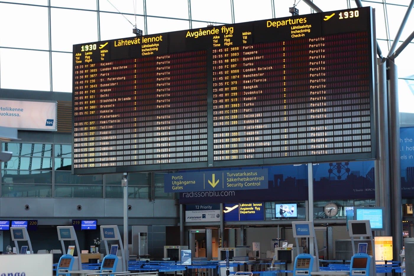 Airport departures board with every flight marked as cancelled