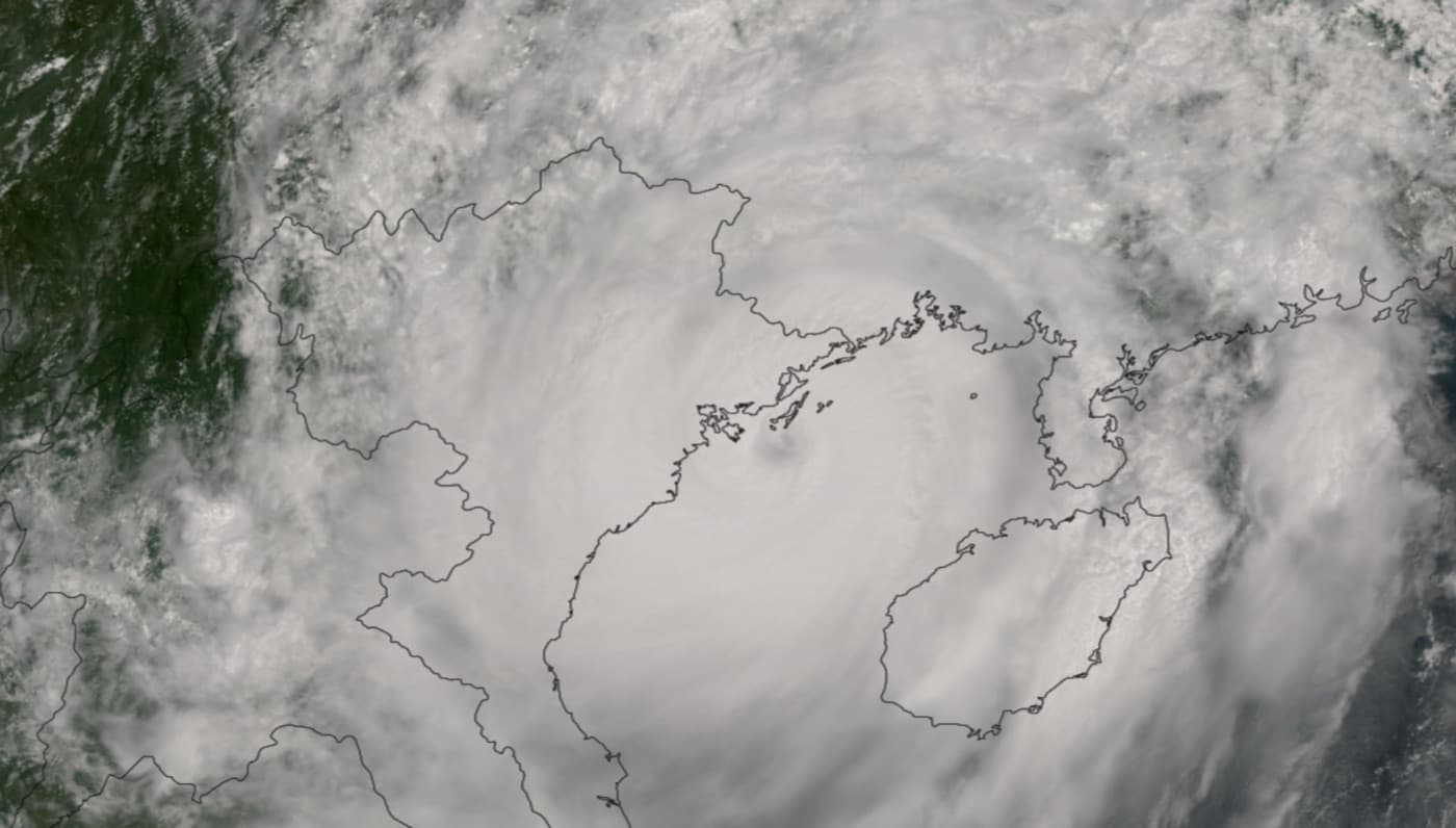 Satellite image of Typhoon Yagi over northern Vietnam with the coastline and Hainan Island outlined
