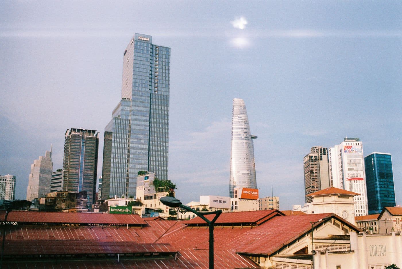 Ho Chi Minh City business district: the Bitexco and Keppel towers above the roofs of Ben Thanh market